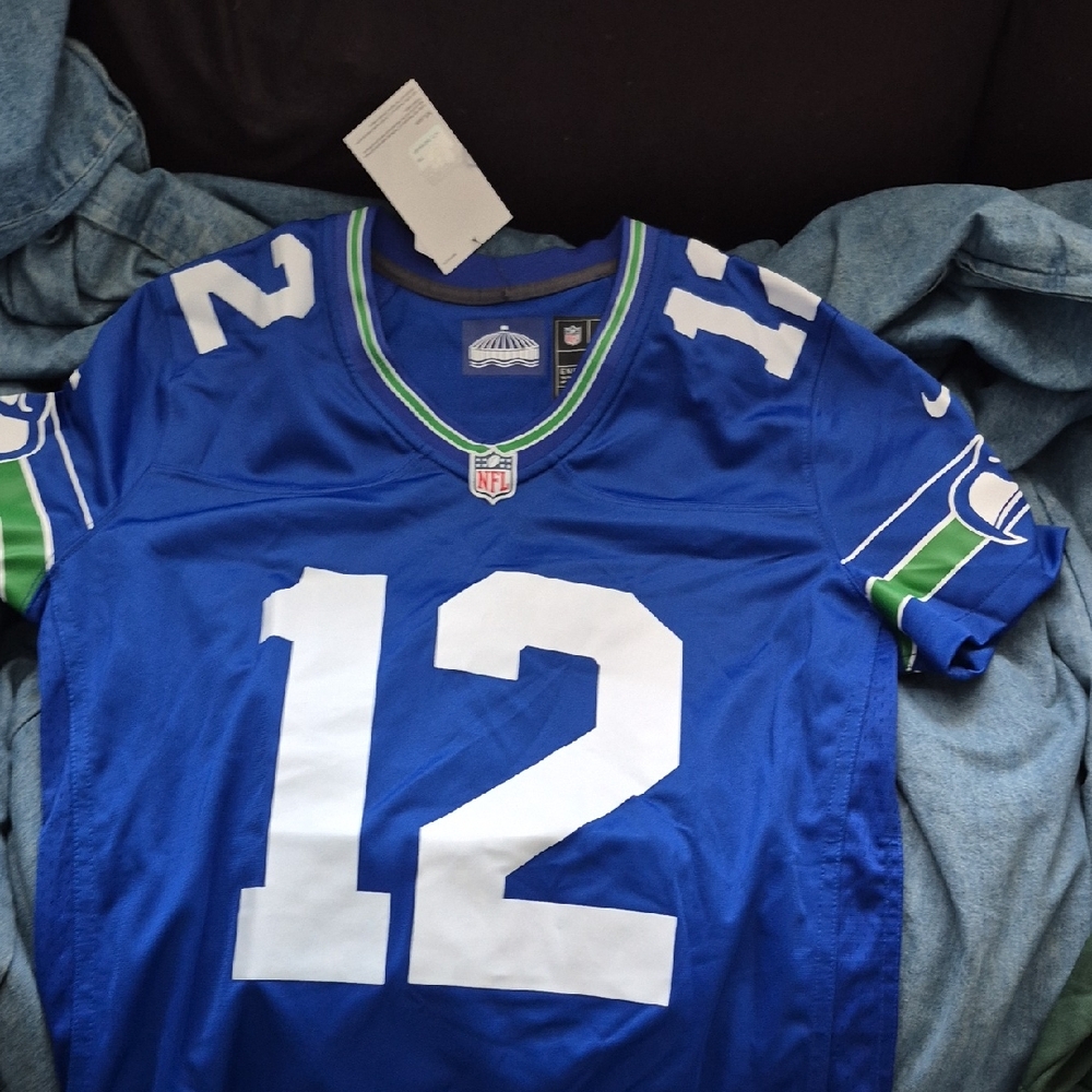 Nike Blue Football Jersey with White Numbers and Green Accents